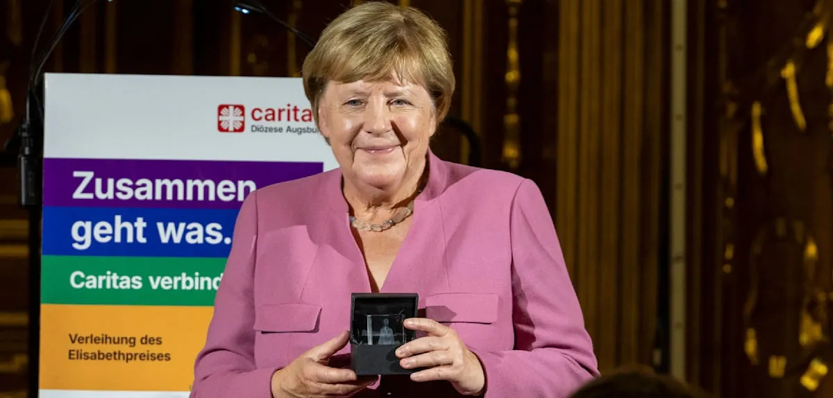 Ironic Acclaim for Angela Merkel: Award Amidst Sharp Criticism